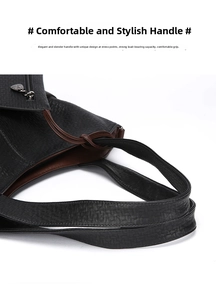 Detailed shot of black elephant pattern leather tote with braided knot handle decoration
