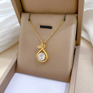 Detailed view of fish tail pendant with crystals in a premium jewelry gift box