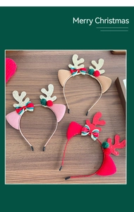 Close-up of festive Christmas reindeer antler headbands with sequins and bows on wood