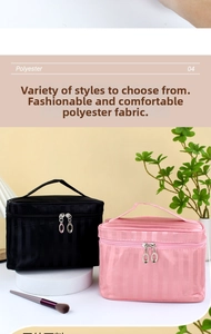 Close-up of pink and black polyester toiletry bags with vertical striped texture and dual zippers