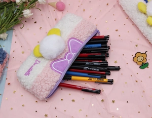 Detail of plush pencil case showing large capacity with colorful pens and soft lamb wool