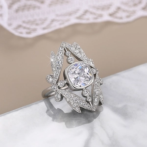 Luxurious silver crown ring with cushion-cut clear gemstone and marquise side stones