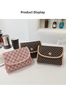 Detailed view of three vintage crossbody bags with clover prints and gold buckles