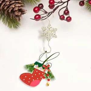 Christmas snowflake metal hook with red polka dot stocking and festive pine decorations