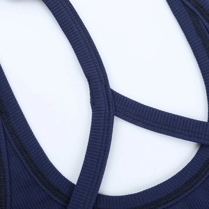 Close-up of navy blue ribbed knit tank top showing high-quality neckline stitching