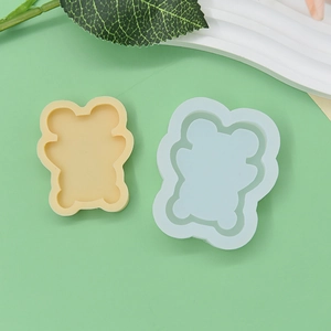 Detailed top view of double-layered bear-shaped silicone molds for DIY baking and crafts