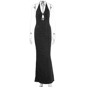 Detail of a black shimmering halter neck evening gown with teardrop cutout and backless design