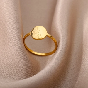 Detailed close-up of 18K gold stainless steel ring with crescent moon and hand design