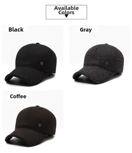 Close-up of winter baseball caps in black, grey, and coffee colors with ear protection