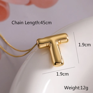 Detailed view of the golden letter T balloon pendant with dimensions and chain length