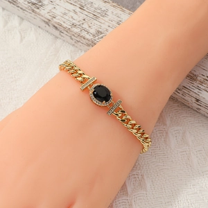 Luxury gold oval black stone Cuban link bracelet with sparkling diamond accents for women