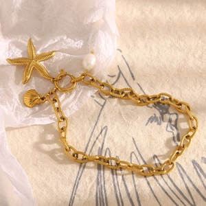 18K gold plated stainless steel anklet featuring starfish, shell, and pearl charms