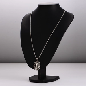 Vintage silver oval pendant necklace with religious portrait on a box chain