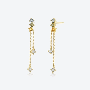 Close-up of gold long tassel earrings featuring colorful blue, green and yellow gemstones