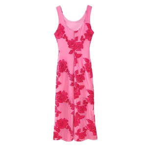 Close-up of intricate red floral embroidery on pink sleeveless resort midi dress