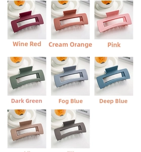 Detailed flat lay of matte rectangular claw clips in eight various trendy muted colors
