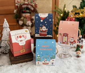 Detailed view of festive Christmas gift boxes with handles in various holiday designs