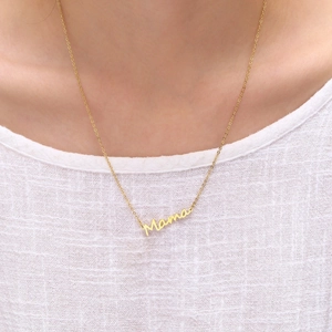 Close-up of 18K gold plated Mama script letter pendant necklace worn by a model