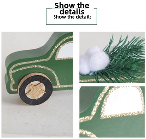 Close-up of green wooden Christmas car with gold glitter outlines and pine needle decor