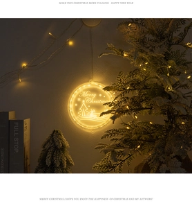 Macro shot of 3D acrylic LED reindeer light with Merry Christmas pattern on white wall