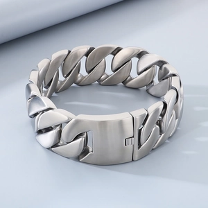 Detailed macro view of heavy brushed stainless steel cuban link chain with matte finish