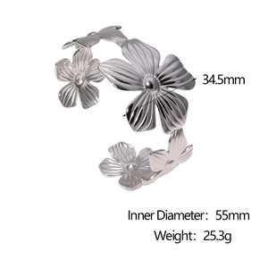 Detail view of silver stainless steel floral open bangle with dimensions and weight specs