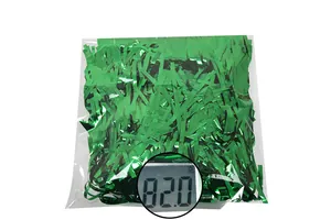 Detail showing 82g of green metallic tinsel filler shredded paper for festive party decor