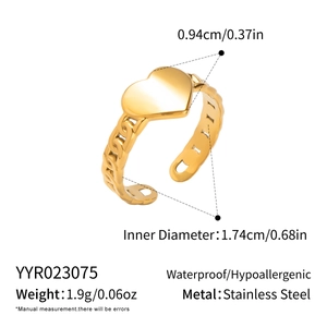 Macro view of gold heart ring with dimensions, showing 1.74cm diameter and 0.94cm heart width