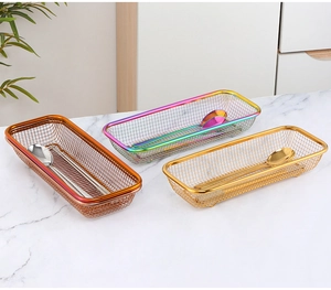 Detail of rose gold, rainbow, and gold rectangular perforated metal mesh cutlery baskets