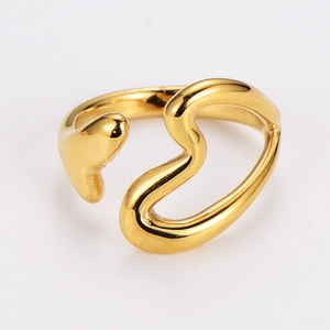 Detail view of the polished golden heart hollow open ring on a clean white background