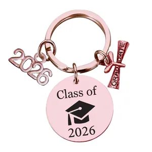 Detail of rose gold Class of 2026 graduation keychain with graduate scroll charm