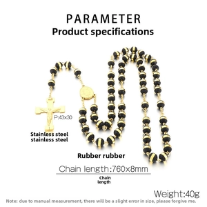 Detailed macro view of 18K gold-plated stainless steel cross necklace with black beads