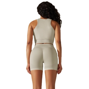 Seamless knitted sports yoga set with racerback crop top and high-waisted gym shorts