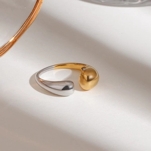 Polished two-tone bulbous open ring in silver and gold finish for minimalist fashion