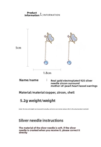 Macro detail of mother-of-pearl heart earrings with zircon tassel and dimension specs