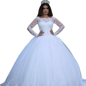Elegant white ball gown wedding dress with long lace sleeves and sheer neckline details