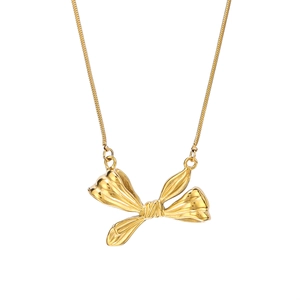 Elegant gold bow pendant necklace with a sleek snake chain in polished stainless steel