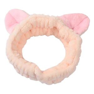 Detail eines rosa Plüsch-Katzenohr-Stirnbands aus weichem Stoff für die tägliche Gesichtspflege