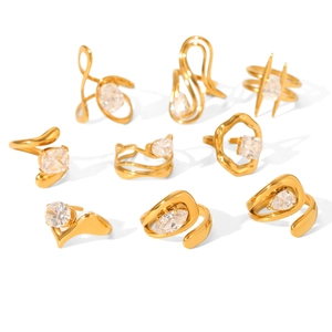 Set of 9 gold-plated stainless steel rings with clear zircon in organic geometric shapes