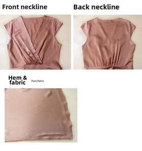 Close-up of rose gold satin fabric showing the deep V-neckline and waist pleat details