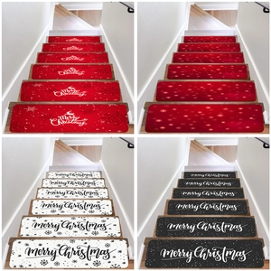 Detail of Christmas stair treads with Merry Christmas text and snowflake patterns