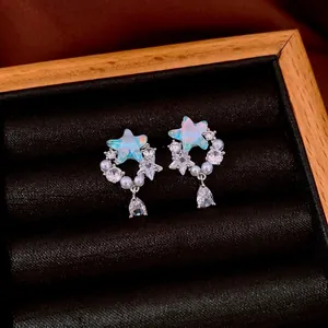 Star-shaped silver drop earrings with colorful opal-like stones, pearls, and pear-cut zircon