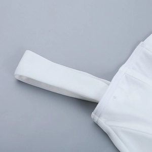 Macro view of white shoulder strap stitching and fabric texture on a corset top