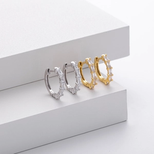 Detailed view of silver and gold S925 sterling silver hoop earrings with square zircon