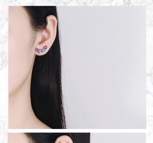 Detail of colorful faceted zircon earrings worn on ear in silver-tone setting