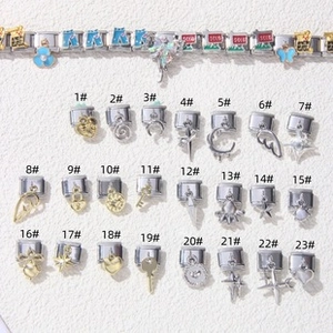 Selection of 23 silver and gold Italian charm links with stars, hearts, and moon shapes