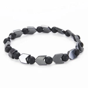 Detailed macro view of 6mm black hematite beads and silver V-shaped metallic spacers