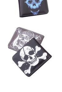 Detail view of men's bifold wallets featuring vintage skull prints and white stitching