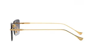 Detail of gold metal temples with textured anti-slip pattern and grey gradient lenses
