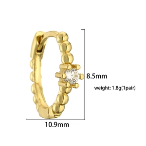 Detail view of 18K gold hoop earring with prong-set zircon and size dimensions